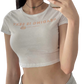 girl wearing cropped tee shirt saying reading is sexy with a peach picture